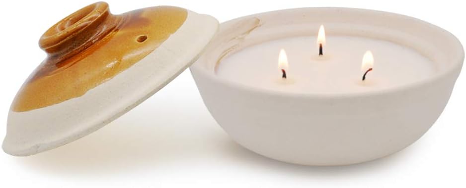 citronella candle in coarse pottery container